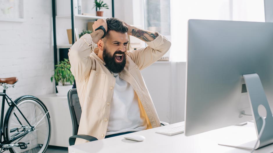 Businessman screaming in office