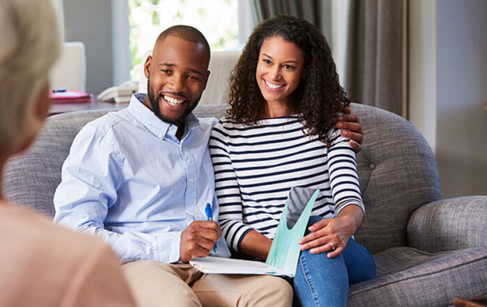 Happy young couple being counseled