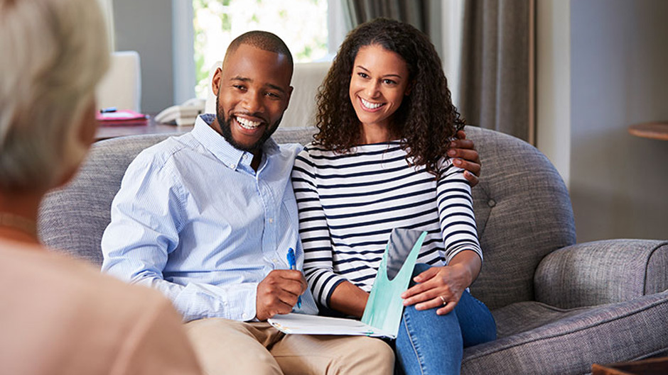 Happy young couple being counseled